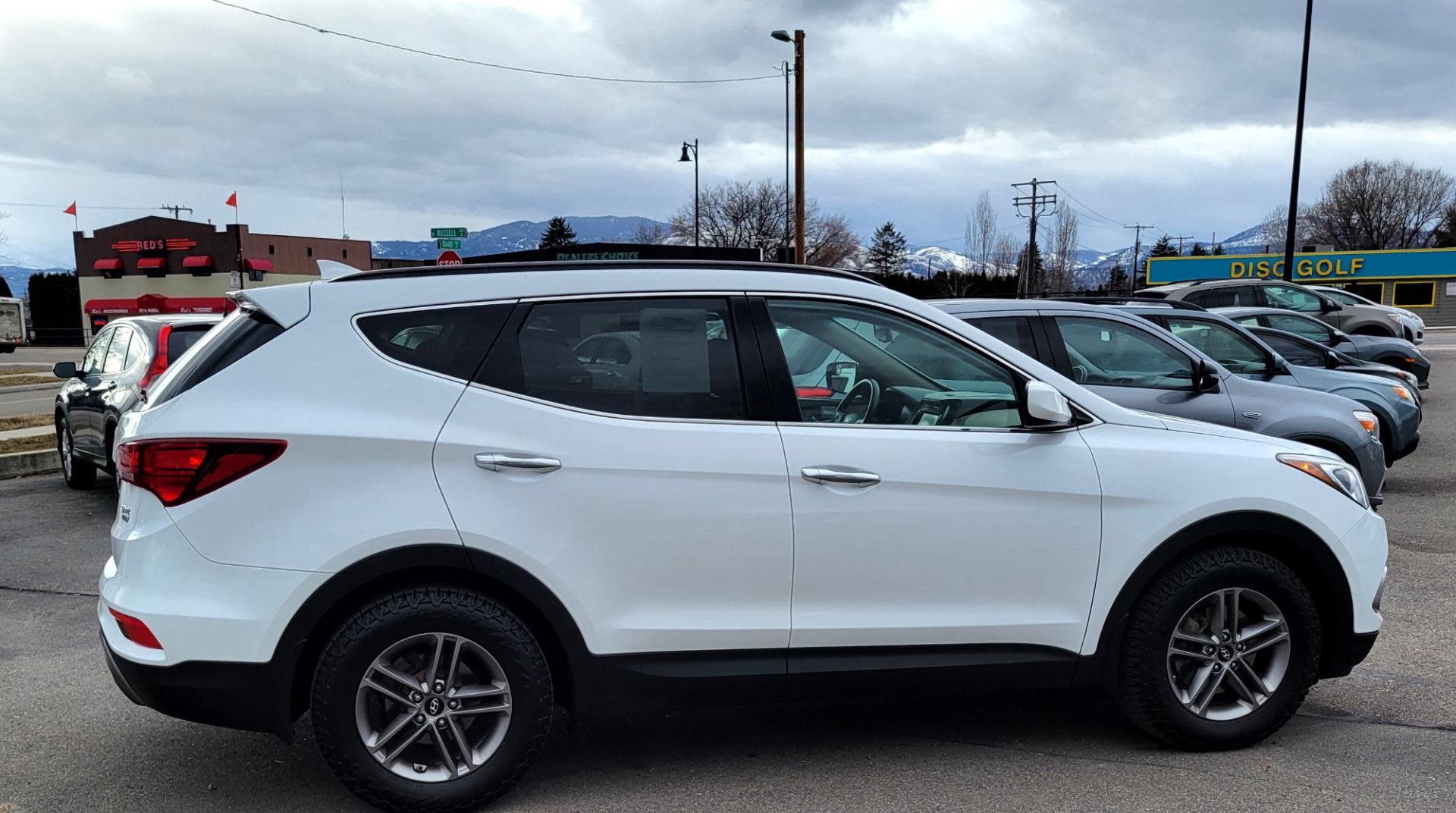 2017 White /Tan Hyundai Santa Fe Sport (5NMZUDLB9HH) with an 2.4L I4 engine, 6 Speed Auto transmission, located at 450 N Russell, Missoula, MT, 59801, (406) 543-6600, 46.874496, -114.017433 - Really Nice AWD SUV. 2.4L I4. 6 Speed Automatic Transmission. Remote Start. Backup Camera. Bluetooth. AM FM XM CD. Air. Cruise. Tilt. Power Windows and Locks. One Owner. Clean Carfax. - Photo#4